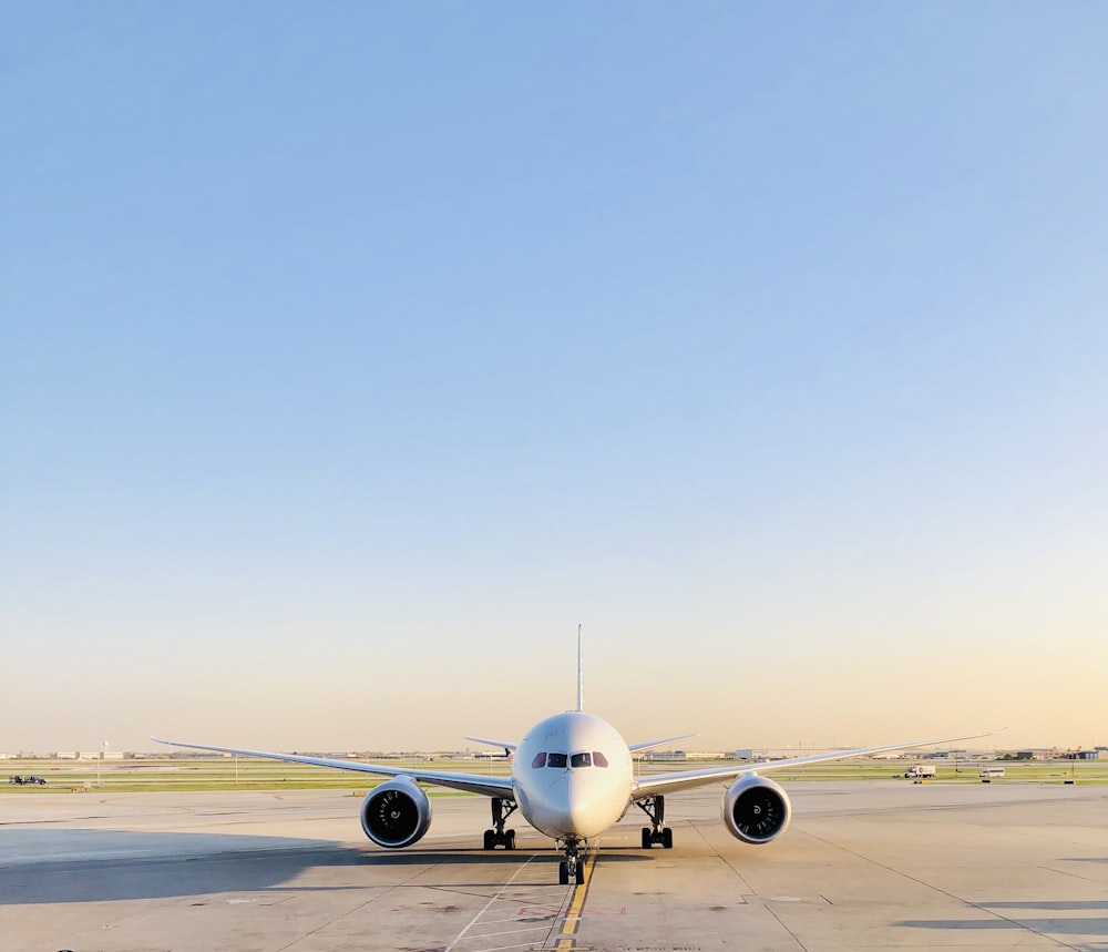 a large jetliner sitting on top of an airport tarmac