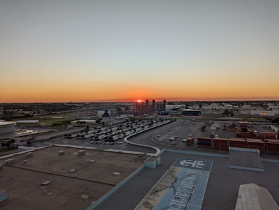 Sunset view over an industrial area showing multiple plots and warehouses.