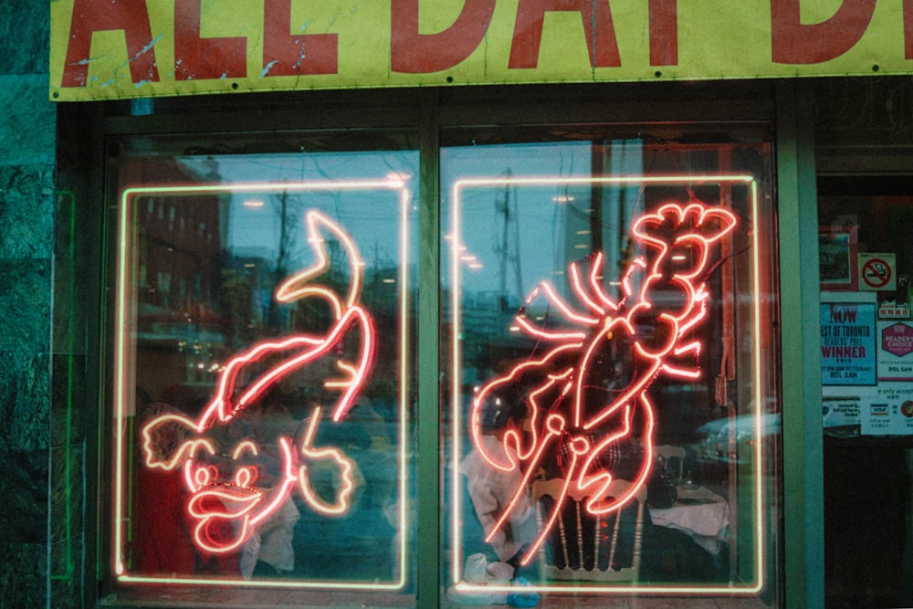 a neon sign in the window of a restaurant