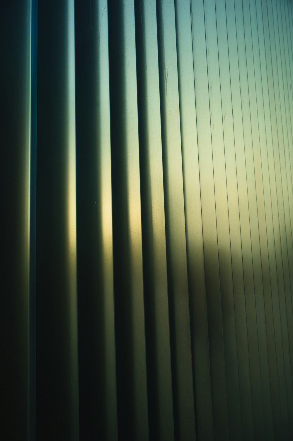 a close up of a window with a sky in the background