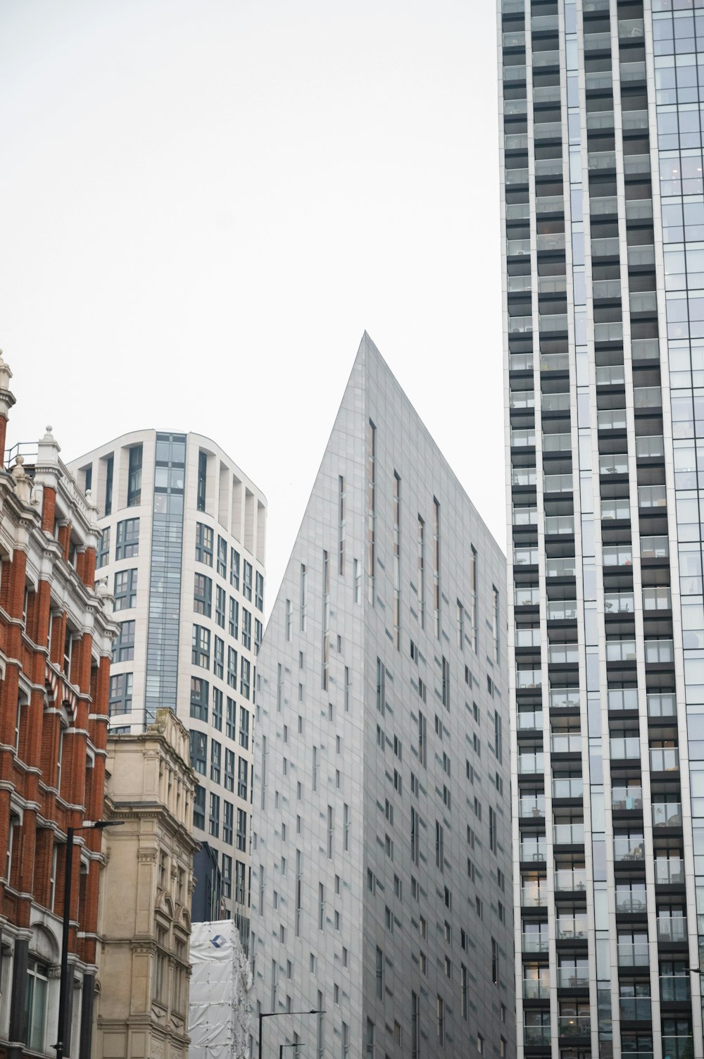 a group of tall buildings next to each other