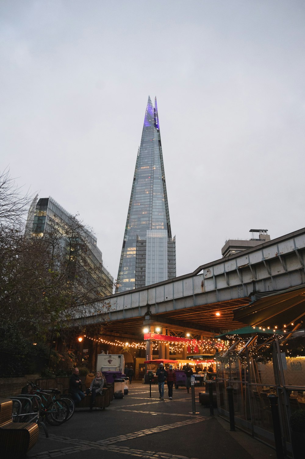 a very tall building towering over a city