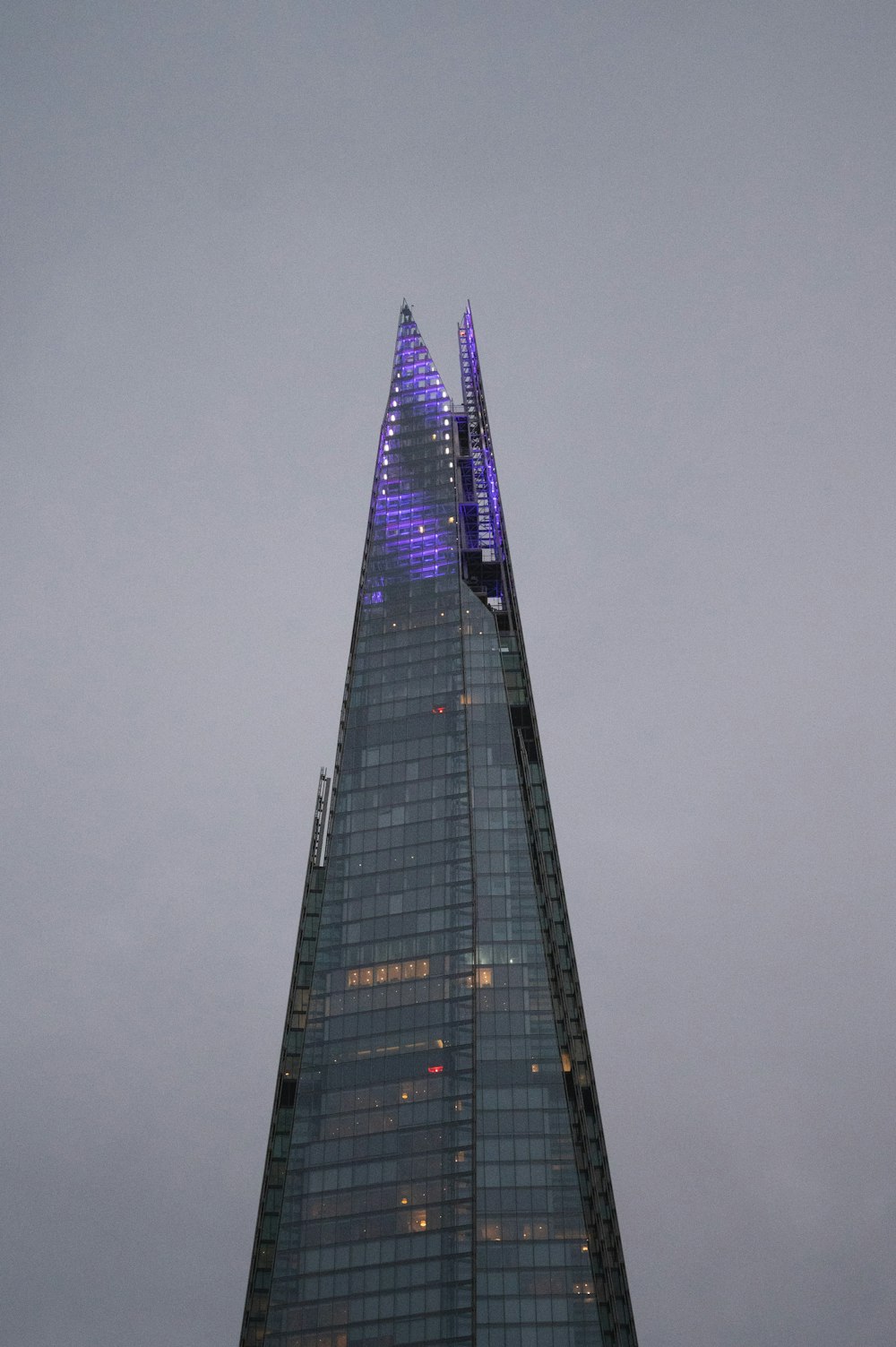 a very tall building with a sky background