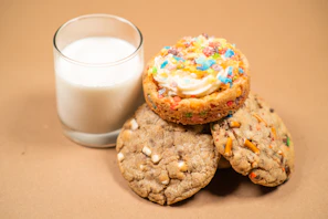 A box of assorted cookies including butter, chocolate, and millet varieties, arranged neatly with a soft cream background.