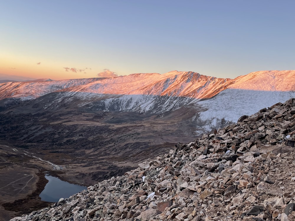 a man standing on top of a rocky mountain