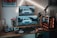 A modern gaming and computer setup featuring multiple monitors displaying an image of a car, a mechanical keyboard, gaming mouse, and a custom desktop PC with RGB lighting. The setup is on a wooden desk alongside professional audio equipment including speakers and a microphone mounted on a stand. Wall art and additional gadgets are visible in the background.