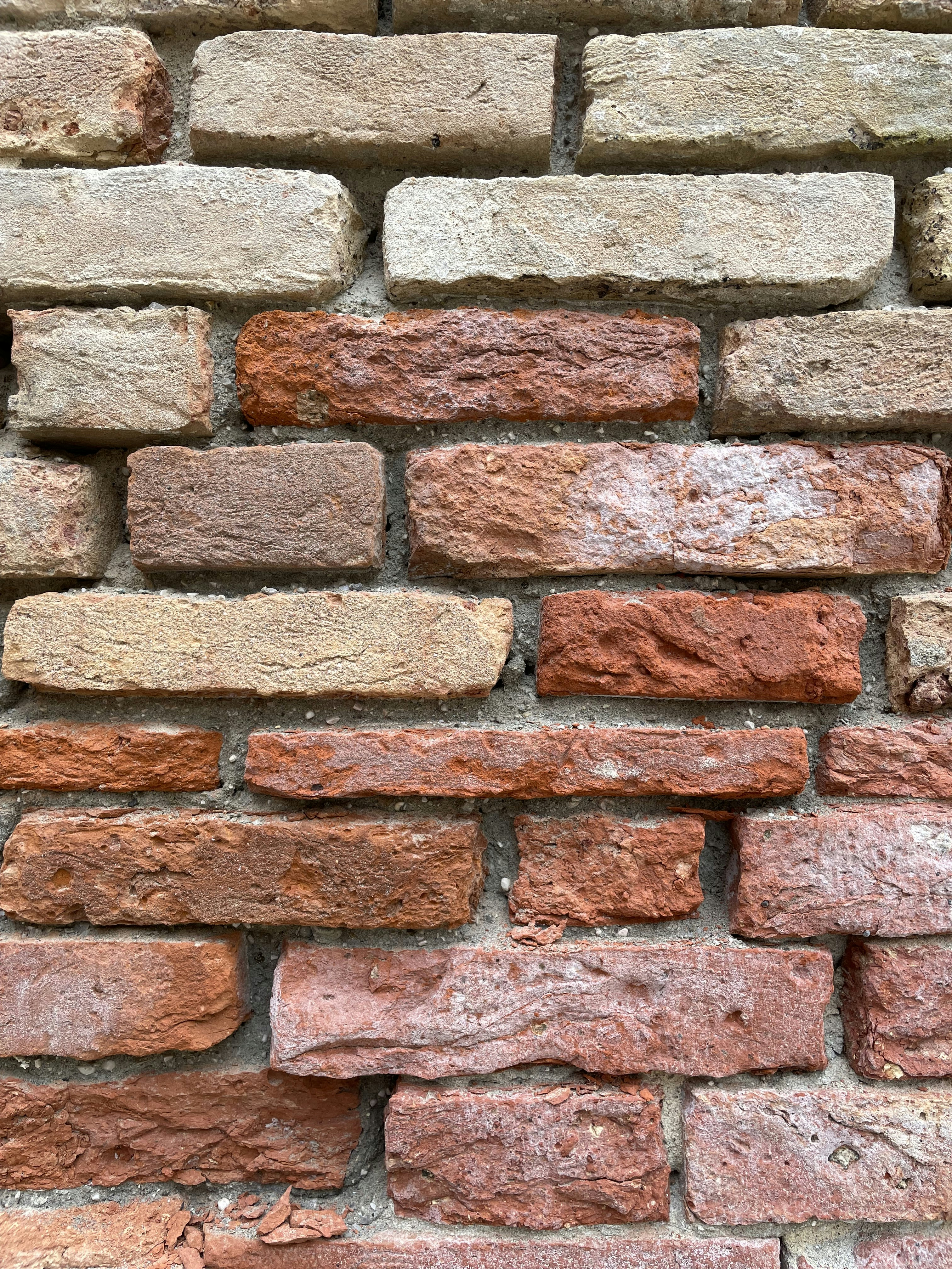 A close up of a brick wall made of bricks photo Free Brick Image on