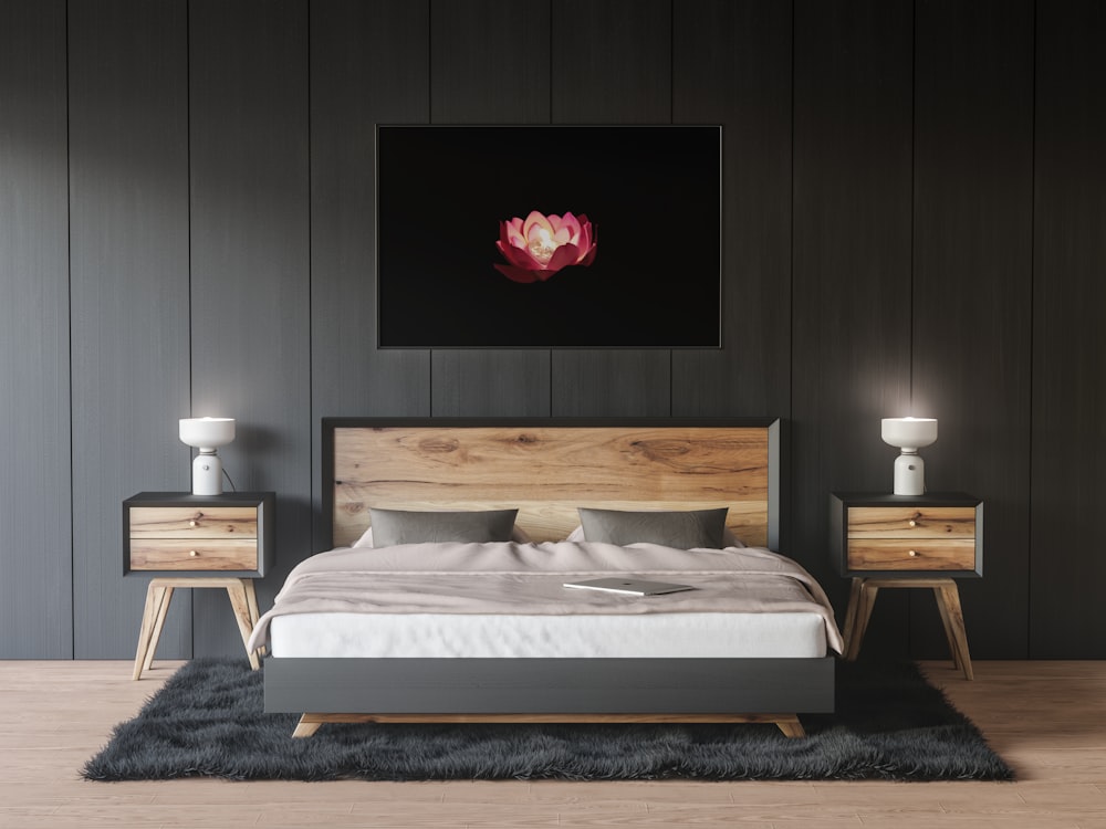 a bedroom with a bed, nightstands and a painting on the wall