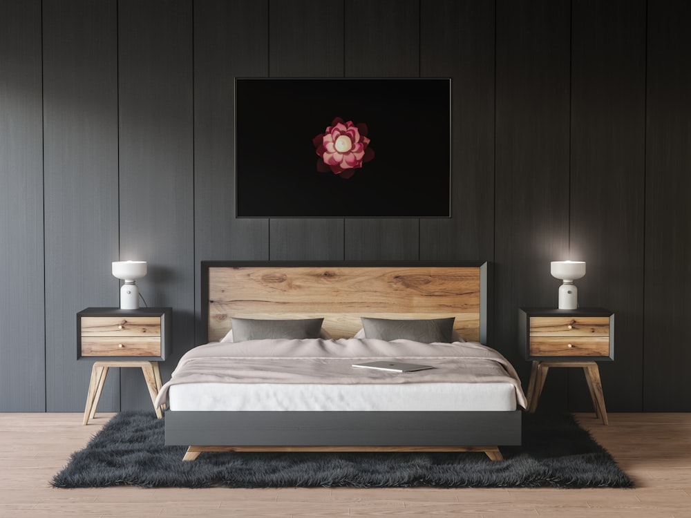 a bedroom with a bed, nightstands and a painting on the wall