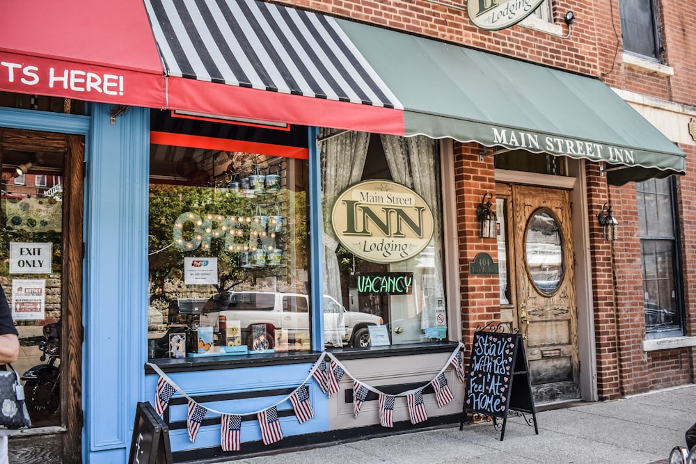 a man walking past a store front on a city street