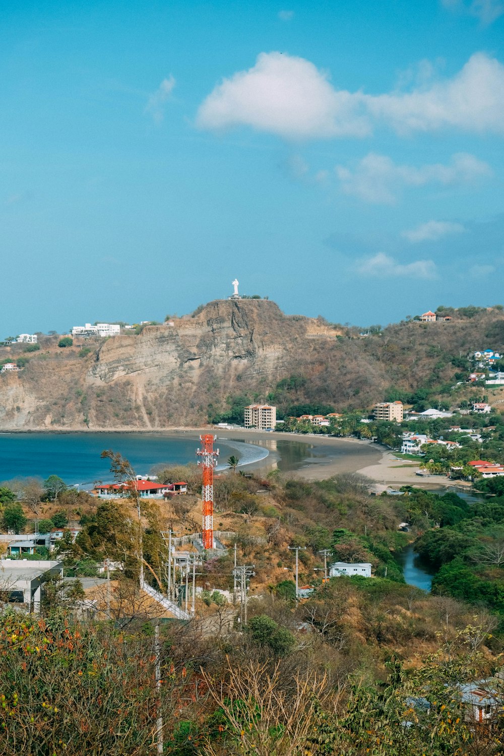 a view of a beach with a mountain in the background