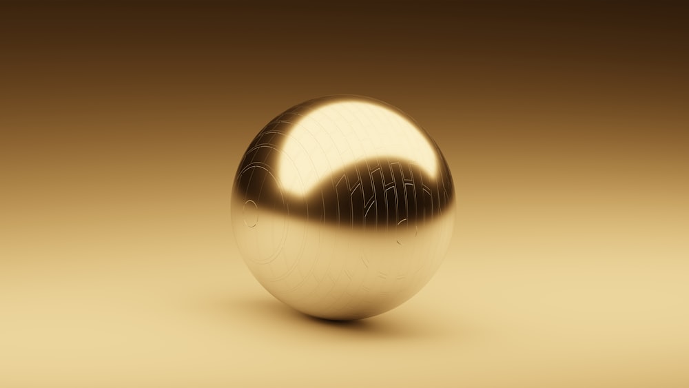a shiny metal object on a brown background