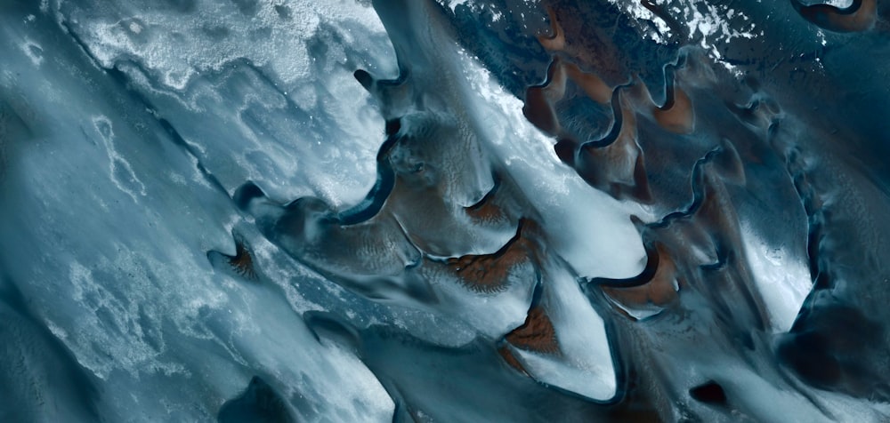 an aerial view of ice and water from space