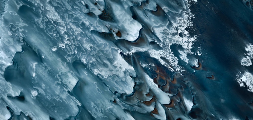 an aerial view of the water and ice
