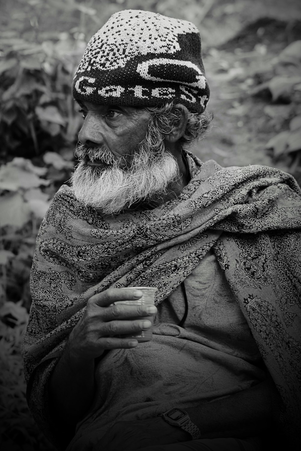 a black and white photo of a man with a beard