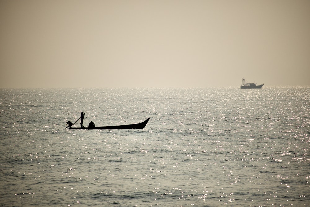 a boat floating on top of a large body of water