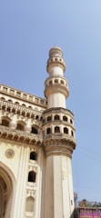 A close-up of a beautifully designed heritage calendar page featuring an old Delhi monument.