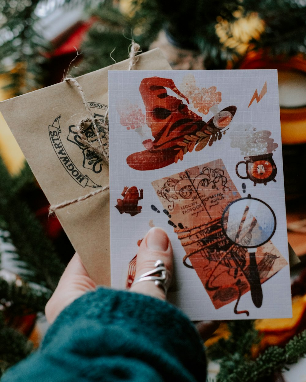 a hand holding a piece of paper with a picture of a person on it