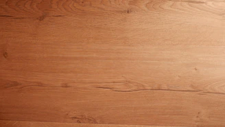 A warm, handcrafted wooden kitchen countertop with natural grain details.