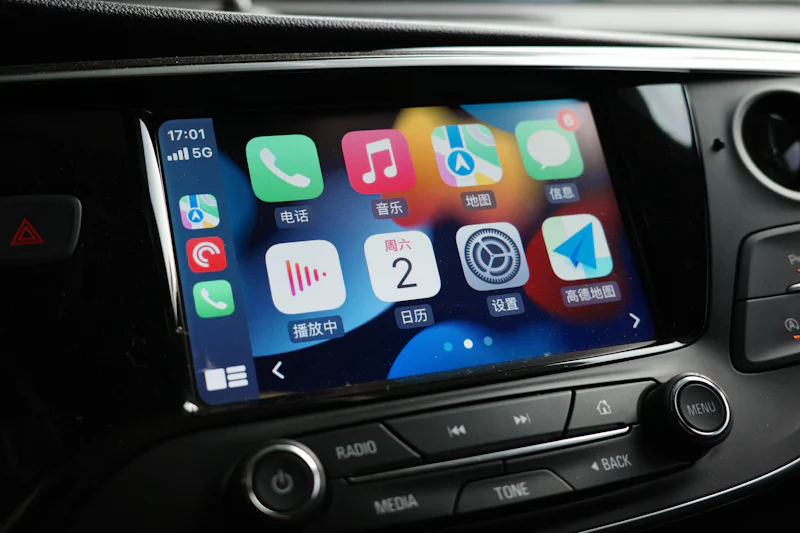 Car dashboard showing Apple CarPlay app icons