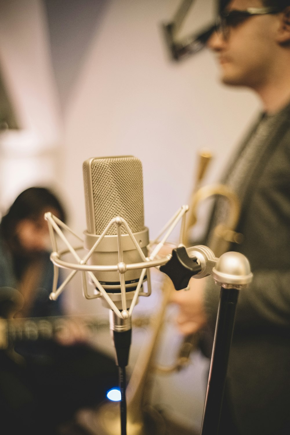 a man standing in front of a microphone