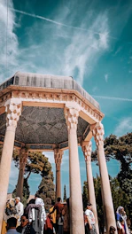 A joyful congregation gathered outdoors in Pune, worshipping together under the open sky.