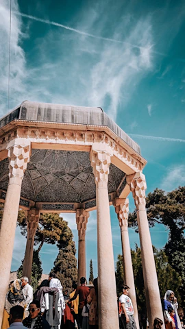 A joyful congregation gathered outdoors in Pune, worshipping together under the open sky.