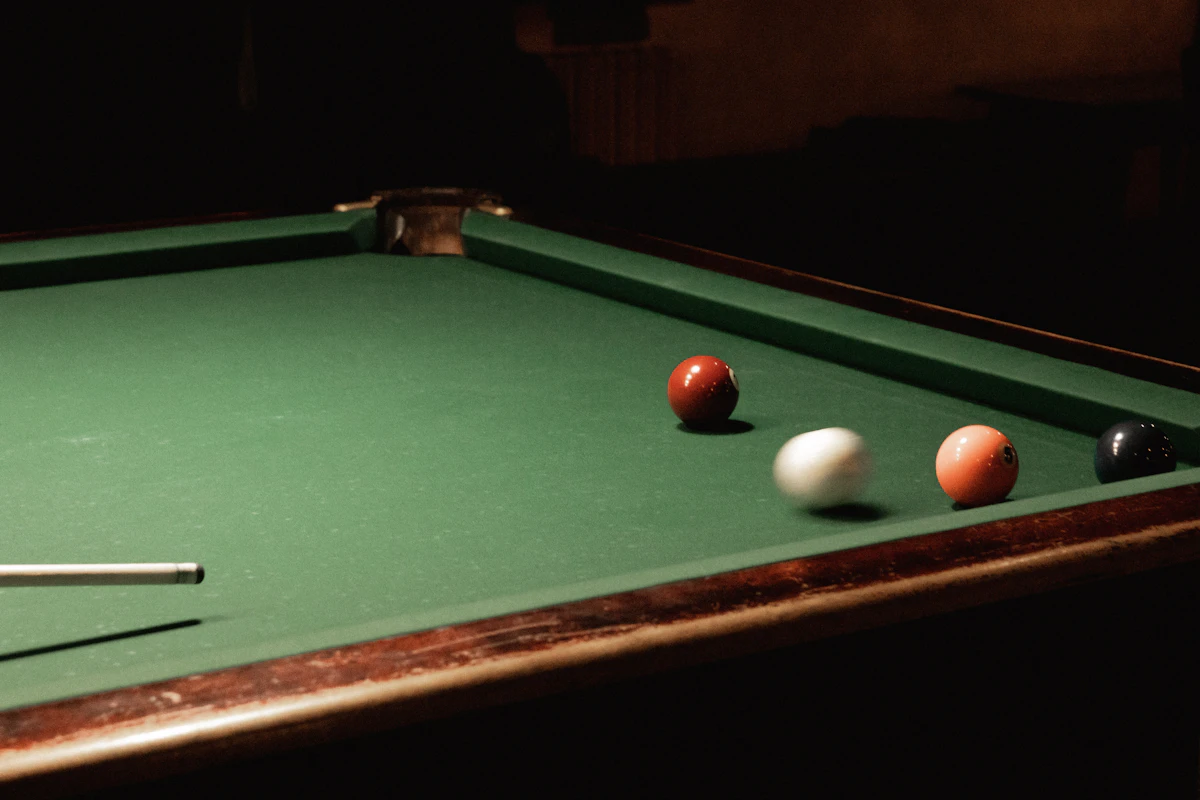 Green billiard cloth on a pool table