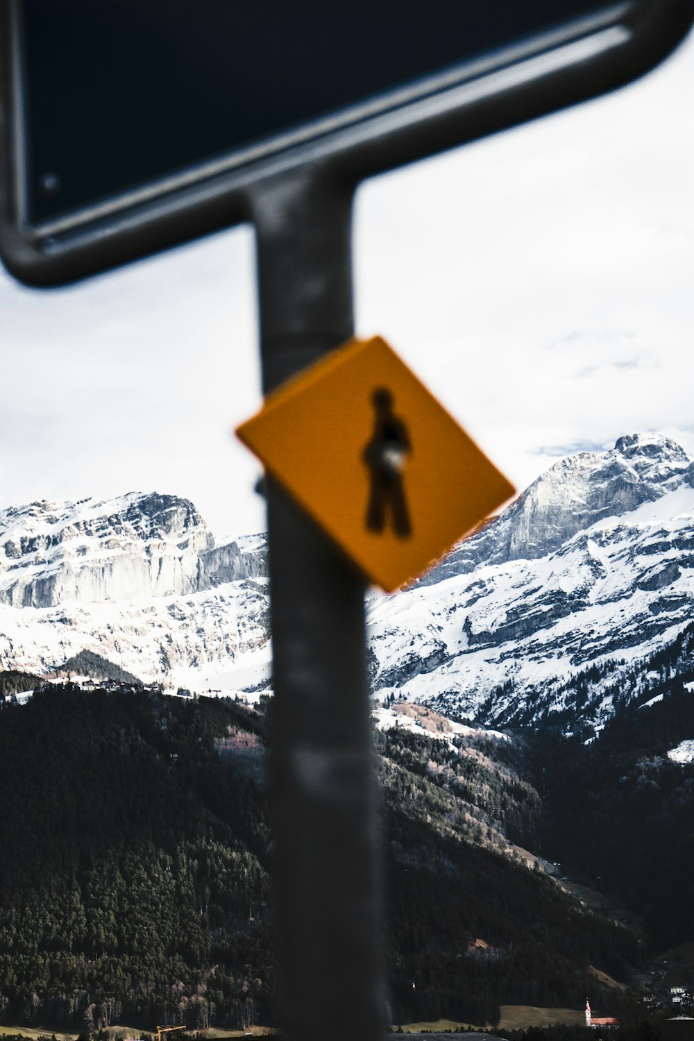 a street sign with a person walking on it