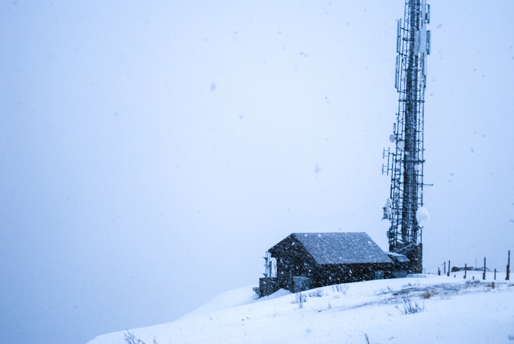 a house on a hill covered in snow