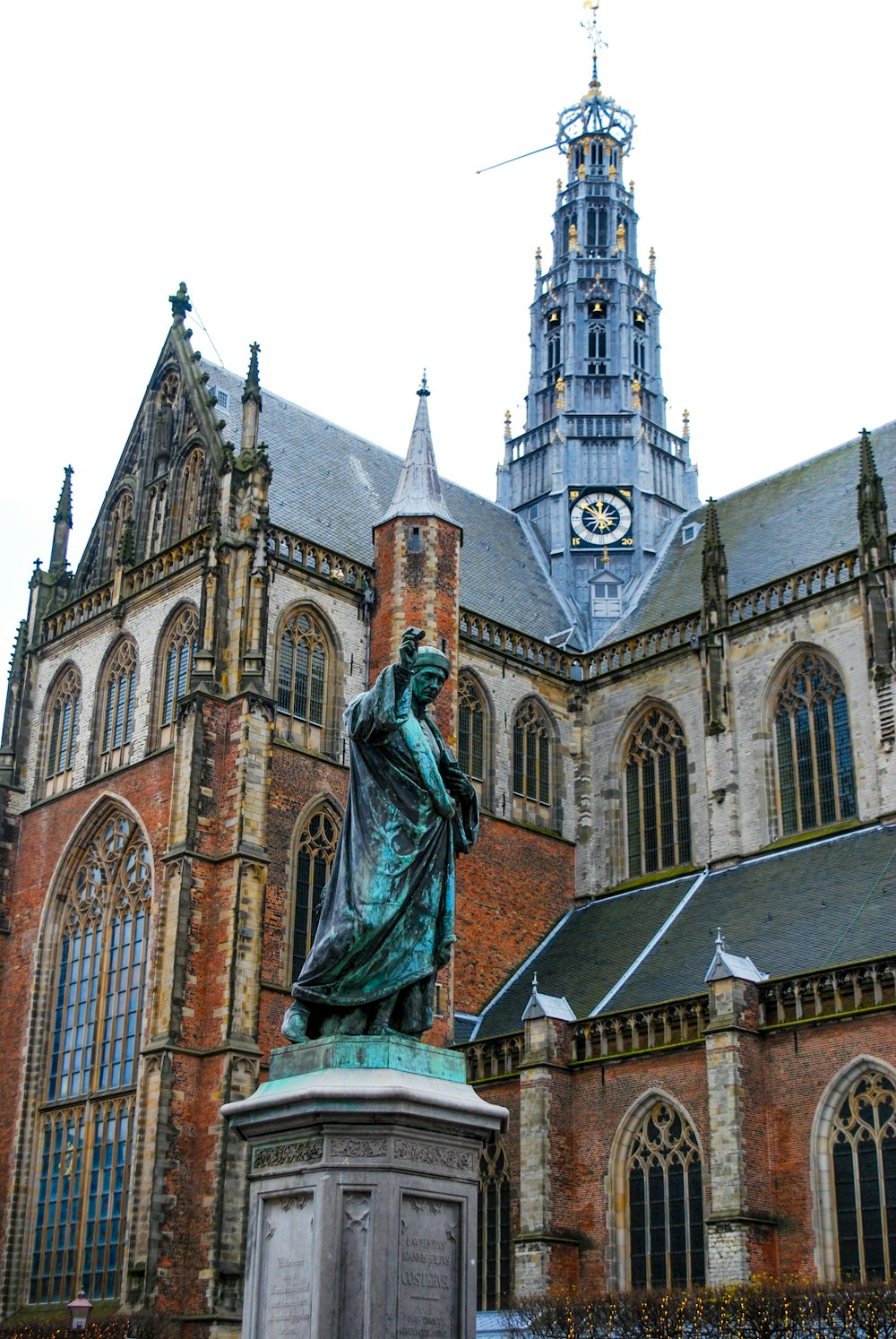 a statue of a woman in front of a church