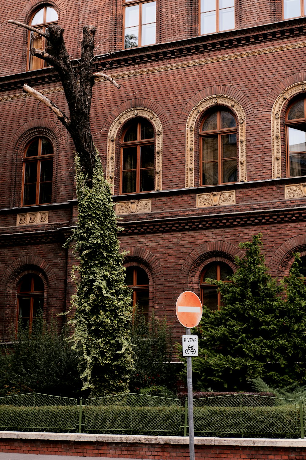 a street sign in front of a brick building