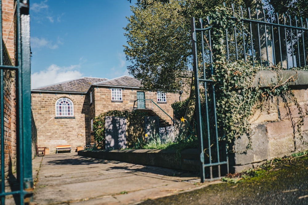 a gated entrance to a brick building