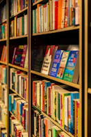 A bookshelf filled with diverse book covers showcasing various genres