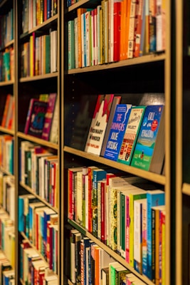 a bookshelf filled with lots of colorful books