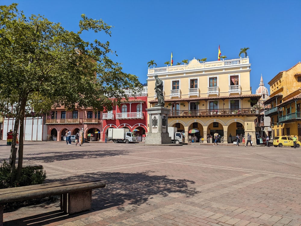 a city square with a bench in the middle of it