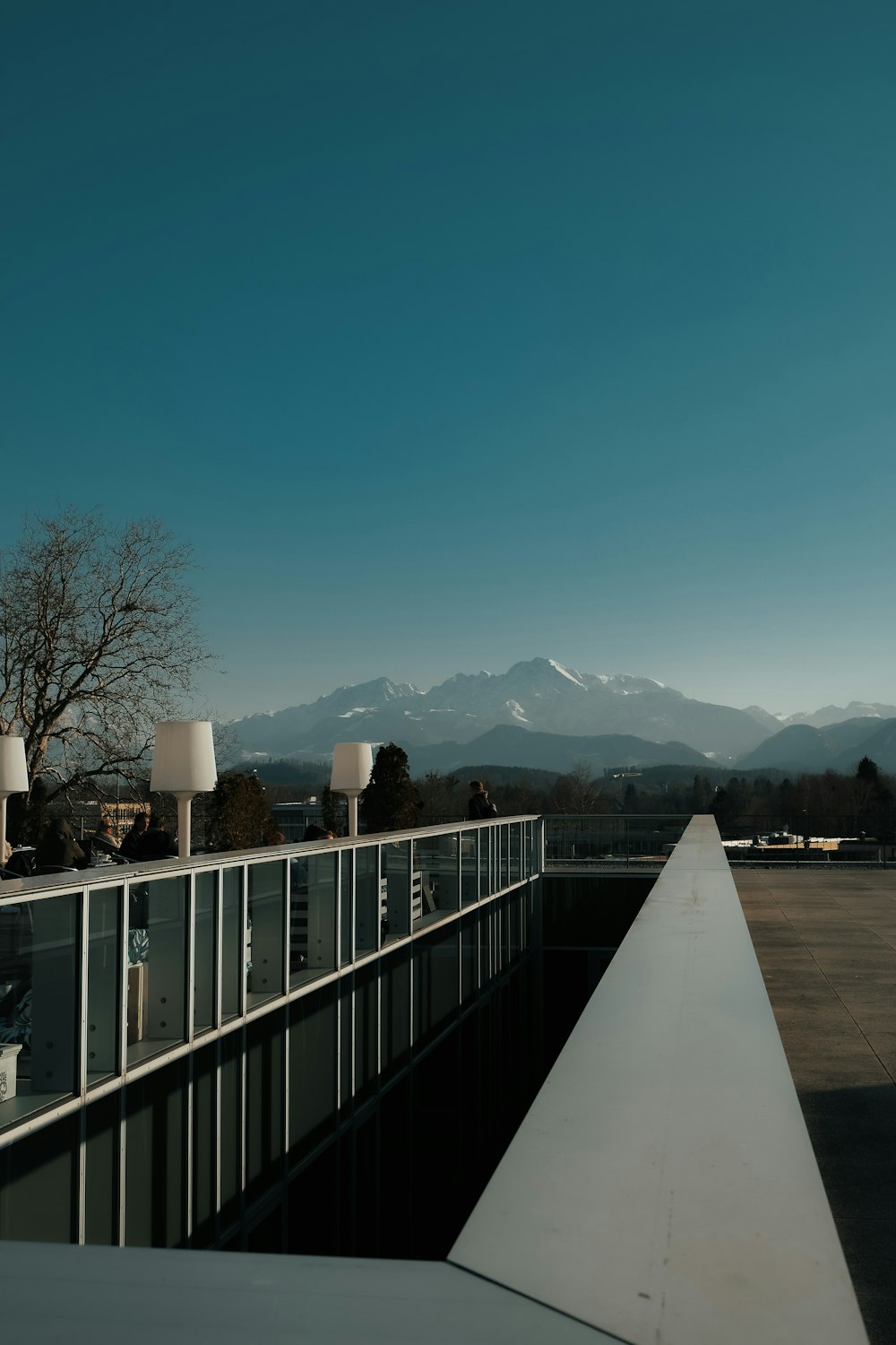 a view of a mountain range from a balcony