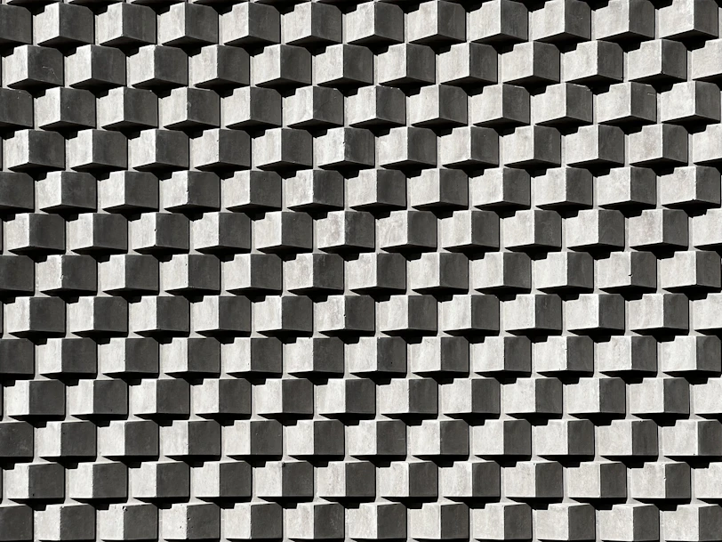 a black and white photo of a brick wall
