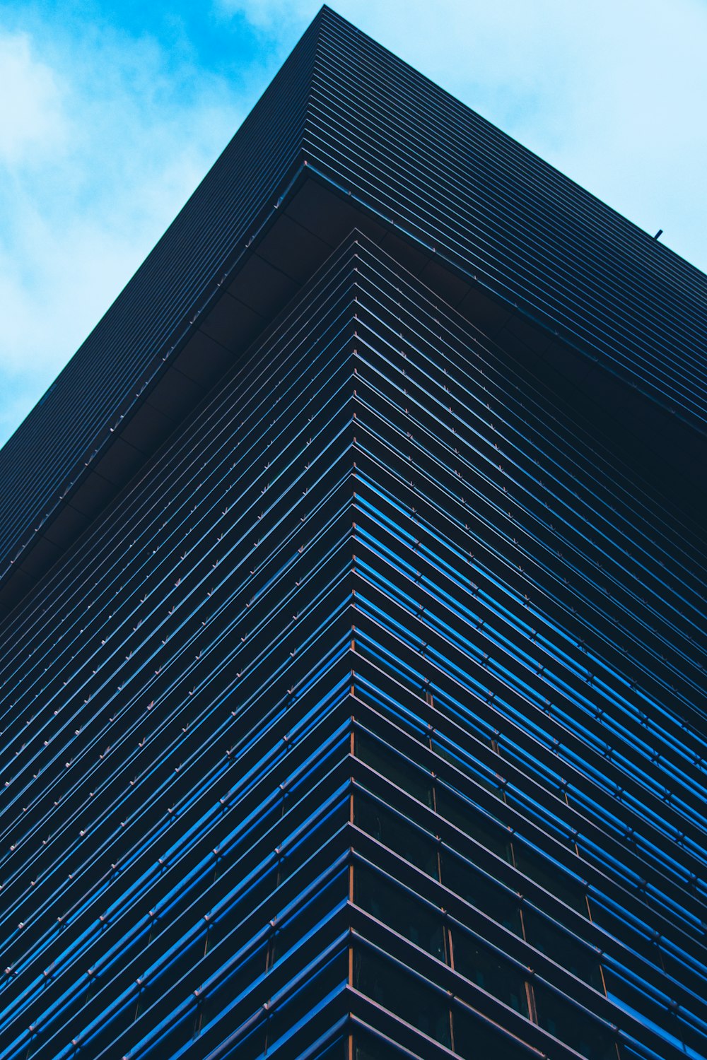 a very tall building with a sky in the background