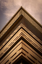 a tall building with a sky in the background