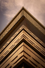 a tall building with a sky in the background