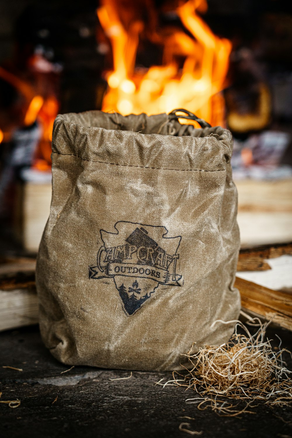 a bag sitting in front of a fire