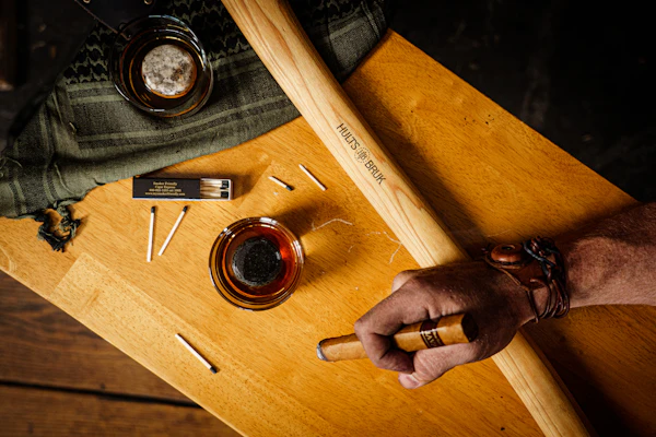 Cigar resting over a wooden ashtray