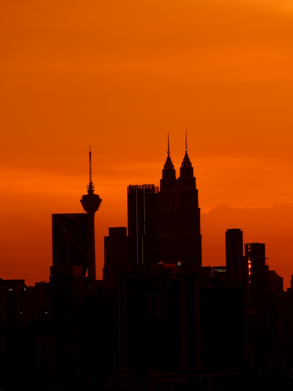 a view of a city skyline at sunset