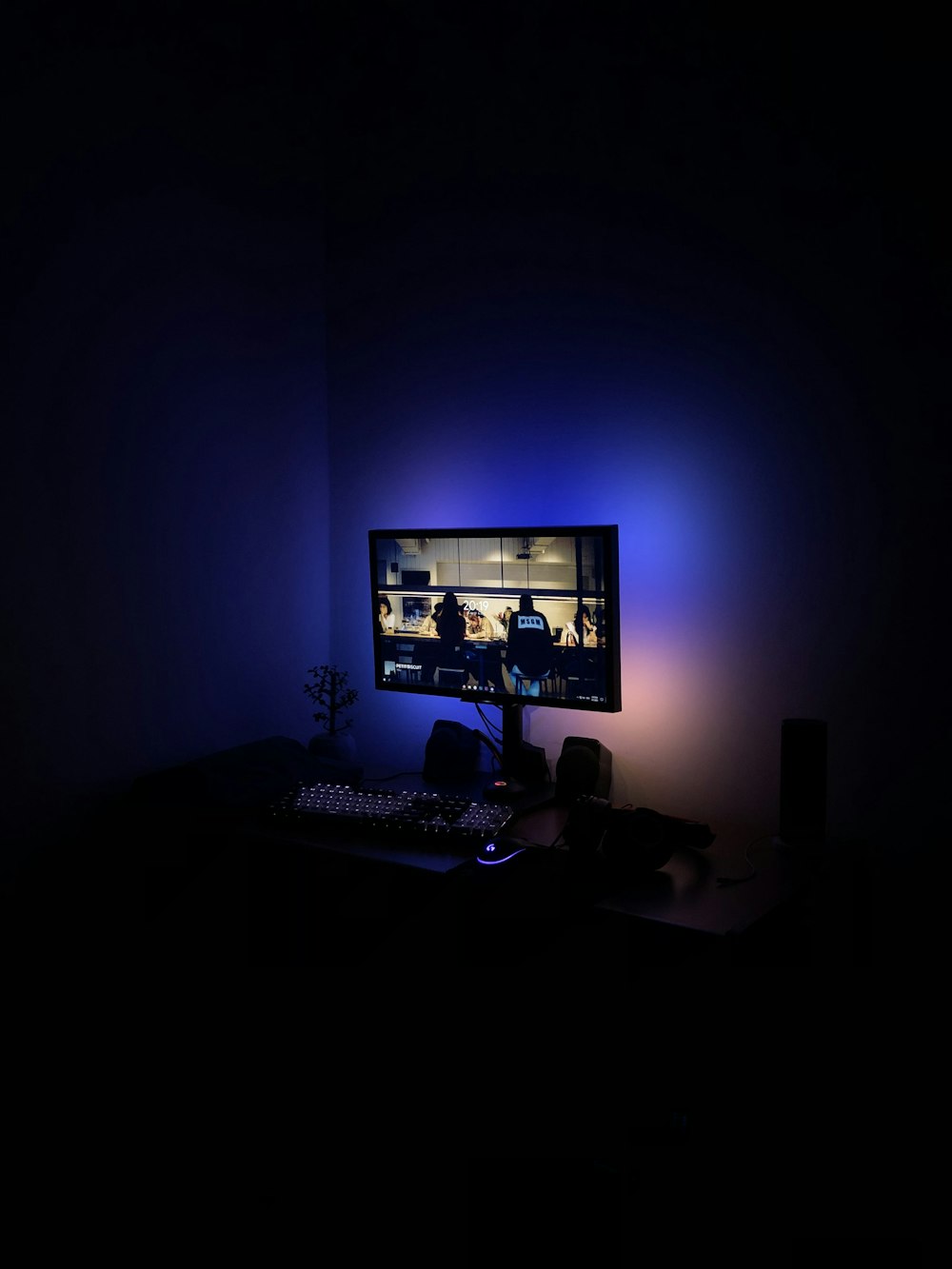 a computer monitor sitting on top of a desk