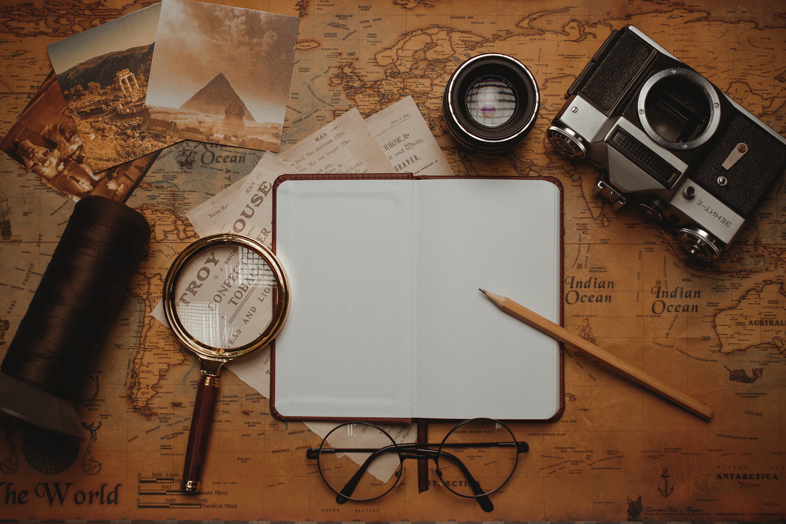 Travel planning with notebook and map