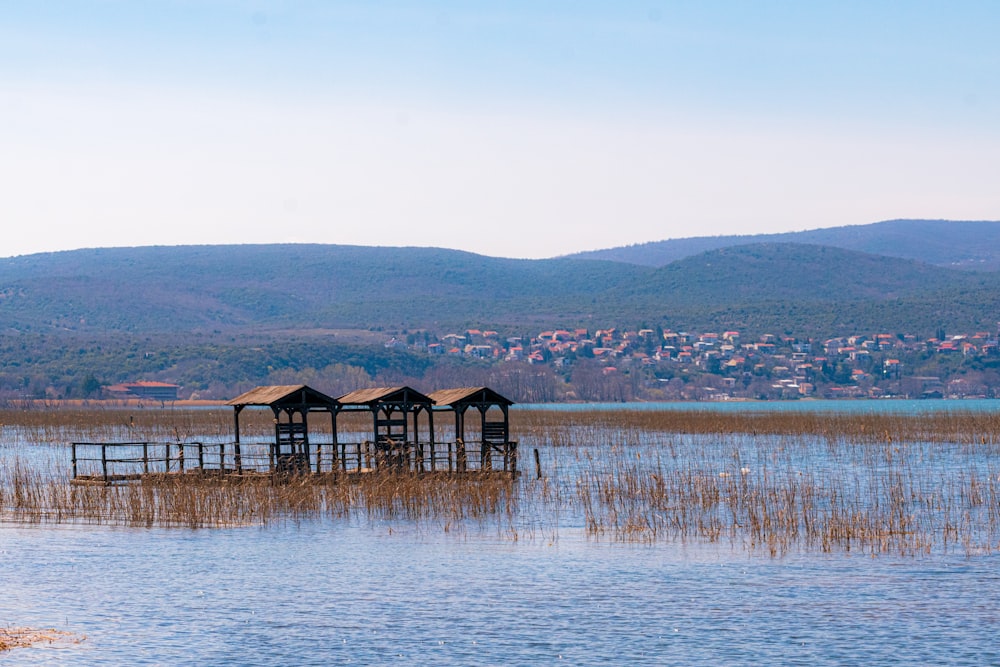 a lake with a dock in the middle of it