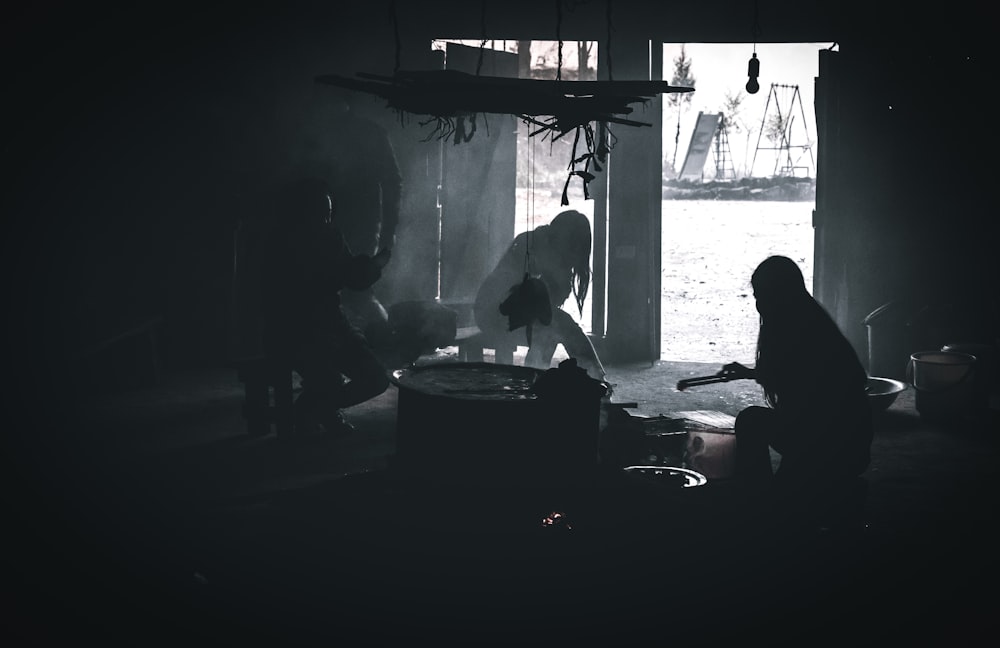 a group of people standing in a dark room