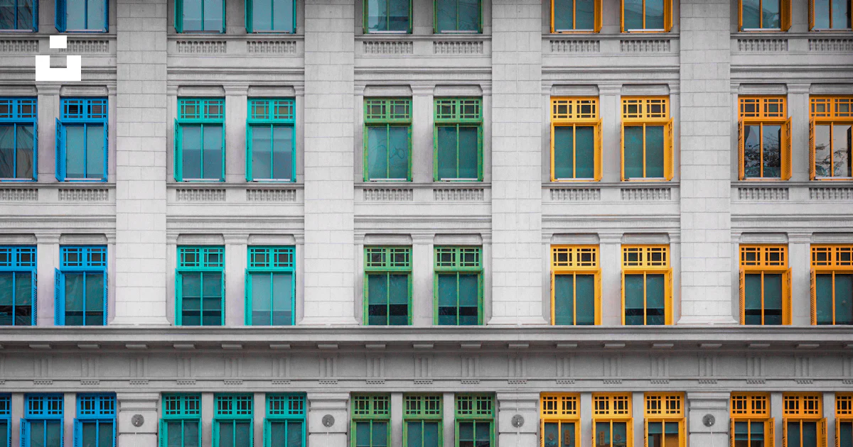 A tall white building with lots of windows photo – Free Building Image ...