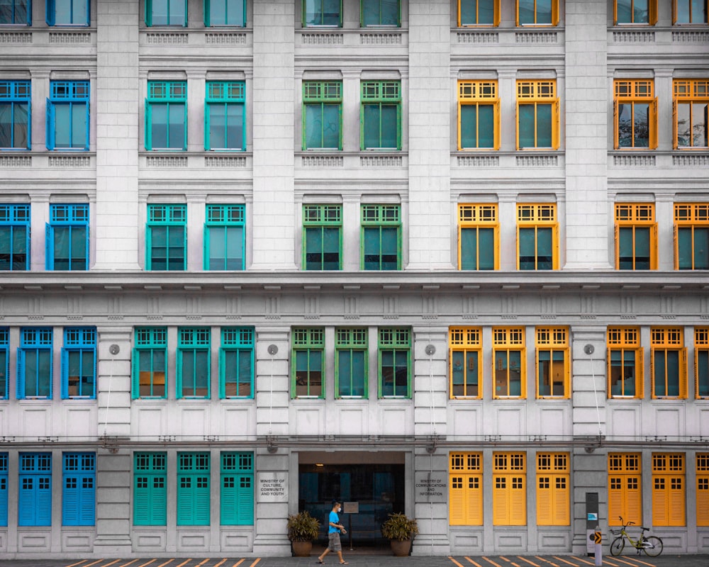 a tall white building with lots of windows